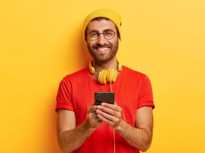 attractive-cheerful-guy-with-bristle-wears-bright-hat-red-t-shirt_273609-27714